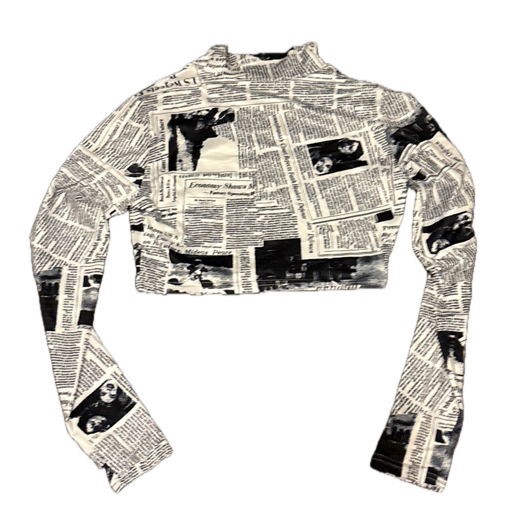 Newspaper print cropped long sleeve top.